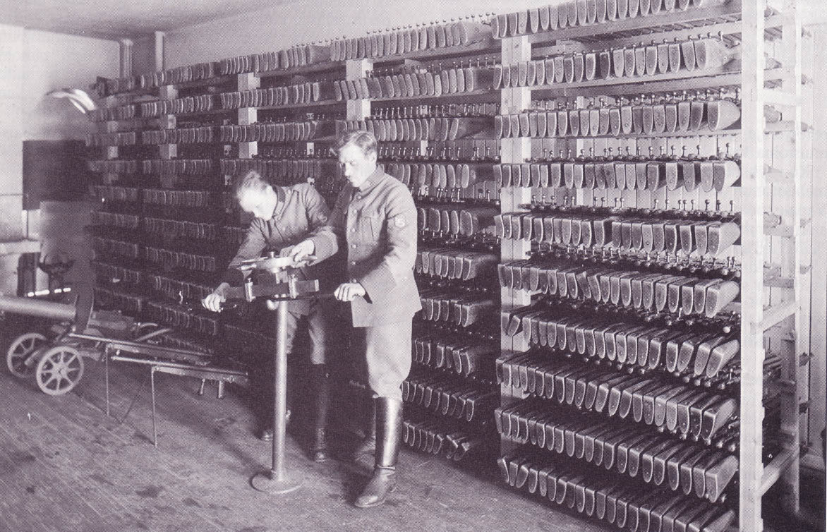 mosin-nagant-rifles-stored-on-racks-in-1930s-finn-armory-along-with-chauchats-and-a-maxim.jpg