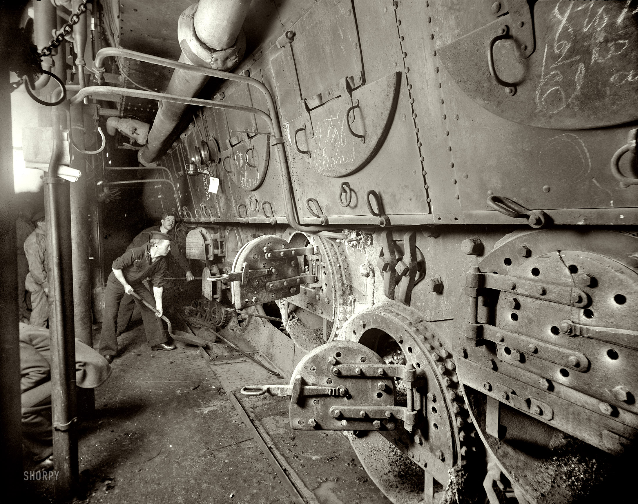 U.S.S. Massachusetts, fire room 1897 note the chalk on the boiler hatches