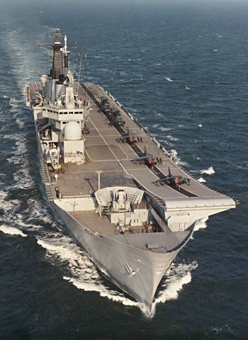HMS Invincible with her Sea Harrier airwing