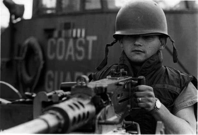 USCG gunner at the ready of his 50-cal aboard an unamed Point of CGS1 in Vietnam,1970 USN photo