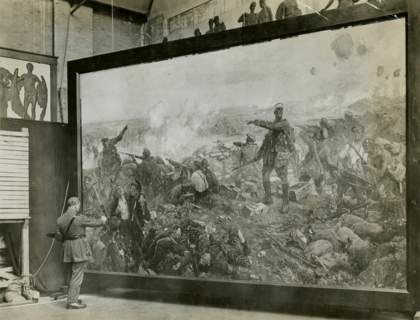 Official war artist Major Richard Jack poses by his painting. 'The Second Battle of Ypres, 22 April to 25 May 1915' depicting Canadian soldiers making a stand against a German assault He painted this enormous work of art, with the canvas measuring 371.5 x 589.0cm (12 x 20 foot), in his London studio, c.1917 Canadian War Memorials Fund (CWMF), an organization established by Lord Beaverbrook to document Canada’s war effort. Sir Edmund Walker, who sat on the advisory board to the CWMF, felt that Jack captured the achievements of the Canadians during the battle, but felt the work would not resonate with Canadians, who, he felt, were “not likely to appreciate such realistic treatment of war.” He was wrong and Jack’s painting remains an iconic work from the First World War. (National Archives of Canada PA 4879) 