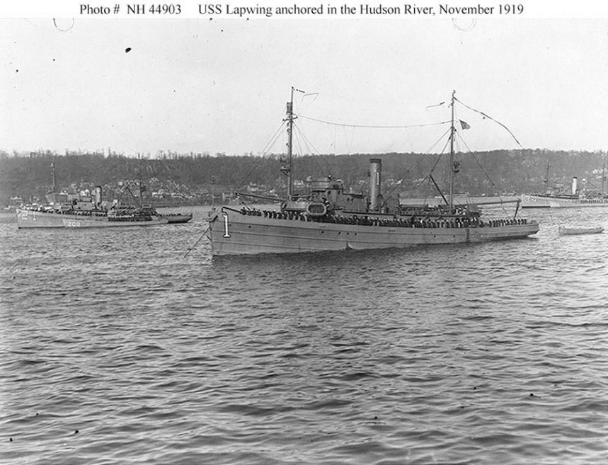 Review of the Atlantic Fleet Minesweeping Squadron, November 1919. USS Lapwing (AM-1) and other ships of the squadron anchored in the Hudson River, off New York City, while being reviewed by Secretary of the Navy Josephus Daniels on 24 November 1919, following their return to the United States after taking part in clearing the North Sea mine barrage. The other ships visible are: USS Lark (Minesweeper No. 21), with USS SC-208 alongside (at left); and USS Swan (Minesweeper No. 34) with USS SC-356 alongside (at right). Heron was there, but is not seen on the photo. U.S. Navy photo NH 44903