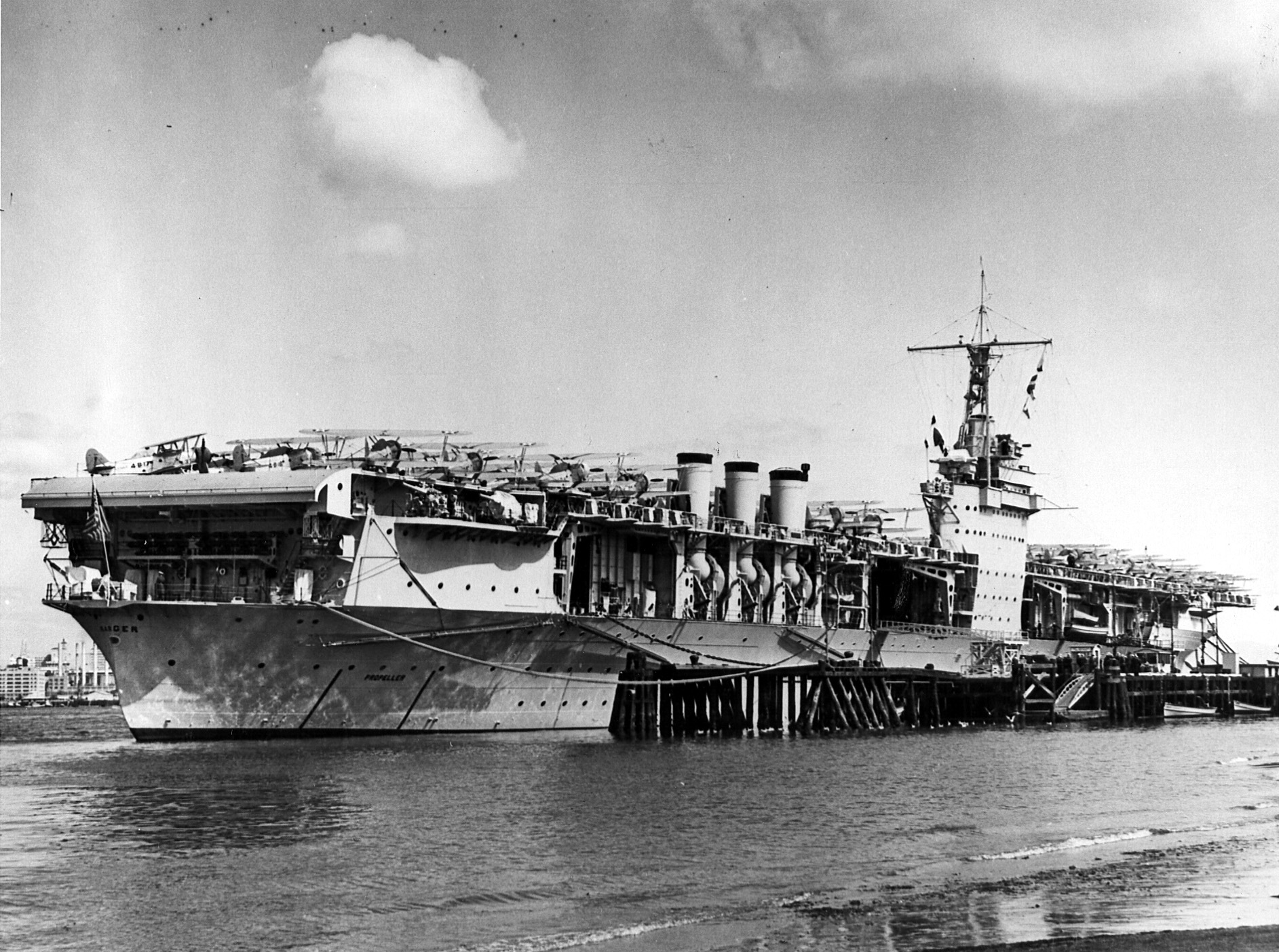 The USS Ranger (CV-4) is moored at North Island, California with aircraft on her deck. 03/14/1938. Naval Aviation Museum Accession Number 1996.488.013.010.