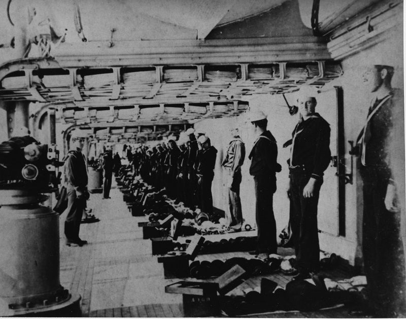 A footlocker inspection on the main deck in 1904. The Sailor on the left, closest to the camera, is Chester Bryon Harper. Courtesy of Mr. Gene B. Reid (Harper's grandson), 1983. U.S. Naval History and Heritage Command Photograph. Catalog #: NH 94193