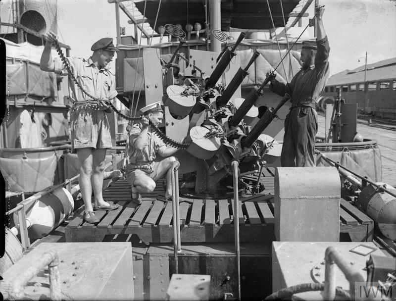 THE ROYAL NAVY DURING THE SECOND WORLD WAR (A 13617) Cleaning and re-ammunitioning the 0.5 inch Vickers machine guns in quadruple Mark III mounting on board HMS CALM in a port in the eastern Mediterranean. The little ship is a minesweeper doing one of the most important, most dangerous and most uncomfortable war jobs. Copyright: © IWM. Original Source: http://www.iwm.org.uk/collections/item/object/205186153