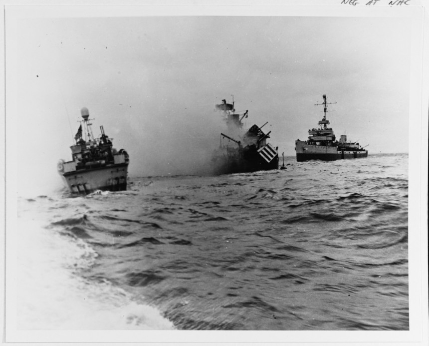 Auk-class minesweeper USS Tide (AM-125) sinking off Utah Beach after striking a mine during the Normandy invasion, 7 June 1944. USS PT-509 and USS Pheasant (AM-61) are standing by. Photographed from USS Threat (AM-124). 80-G-651677