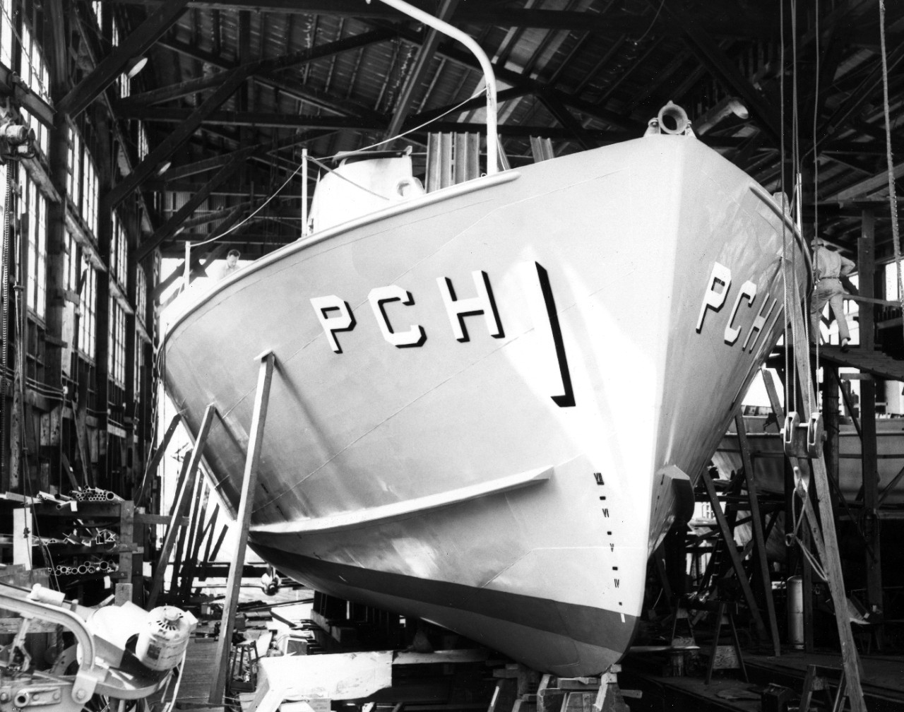 The Navy's first hydrofoil submarine chaser, USS High Point (PCH-1), nears completion at the J.M. Martinac Shipbuilding Corporation, Tacoma, WA. In this photograph the after foil and starboard nacelle are visible. Accession #: L45 Catalog #: L45-125.04.02